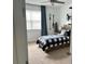 Bright bedroom with a cozy bed, natural light, and charming decor at 1767 Smarts Rule St, Kissimmee, FL 34744