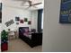 bedroom featuring superhero decor, a ceiling fan, and an adjacent desk at 1767 Smarts Rule St, Kissimmee, FL 34744
