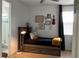 Cozy bedroom featuring a bathroom, ceiling fan, and natural light at 1767 Smarts Rule St, Kissimmee, FL 34744