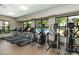 Fitness center with treadmills and elliptical machines, offering a view of the pool at 1767 Smarts Rule St, Kissimmee, FL 34744