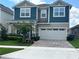 Charming two-story home with a two-car garage, manicured landscaping, and inviting curb appeal at 1767 Smarts Rule St, Kissimmee, FL 34744