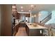 Modern kitchen with stainless steel appliances, an island, and pendant lighting at 1767 Smarts Rule St, Kissimmee, FL 34744