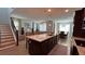 Large kitchen features hardwood floors, granite counters, stainless appliances, and a long island with seating at 1767 Smarts Rule St, Kissimmee, FL 34744