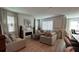Cozy living room featuring ample natural light and an elegant fireplace at 1767 Smarts Rule St, Kissimmee, FL 34744