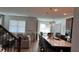 Open-concept living and kitchen area featuring natural light, an island, and comfortable seating at 1767 Smarts Rule St, Kissimmee, FL 34744