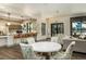 Open-concept space with kitchen bar and dining area featuring modern decor and abundant natural light at 1767 Smarts Rule St, Kissimmee, FL 34744