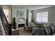 Inviting living room with fireplace, stylish decor, and lots of natural light at 1767 Smarts Rule St, Kissimmee, FL 34744
