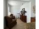 Formal living room with accent furniture and decor, with hardwood style floors at 1767 Smarts Rule St, Kissimmee, FL 34744