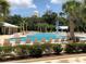 Community pool area with lounge chairs and splash zone, providing a relaxing outdoor experience at 1767 Smarts Rule St, Kissimmee, FL 34744