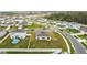 An aerial view of a residential neighborhood, highlighting the layout and proximity of houses with green lawns at 202 Zircon Rd, Kissimmee, FL 34758
