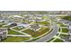 A picturesque aerial shot of a neighborhood featuring modern homes, manicured lawns, and curved streets at 202 Zircon Rd, Kissimmee, FL 34758