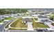 Aerial view of the property showcasing the home's landscaping and neighborhood at 202 Zircon Rd, Kissimmee, FL 34758