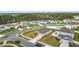 Detailed aerial shot of homes with well-kept lawns in a friendly neighborhood with close proximity to amenities at 202 Zircon Rd, Kissimmee, FL 34758