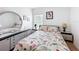 Bright bedroom featuring a comfortable bed, dresser with mirror and lots of natural light at 202 Zircon Rd, Kissimmee, FL 34758