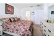 Bedroom view with a comfy bed, dresser, and doorway to the bathroom at 202 Zircon Rd, Kissimmee, FL 34758