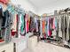 Walk-in closet with organized storage, hanging clothes and shoe racks at 202 Zircon Rd, Kissimmee, FL 34758