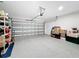 Spacious two car garage with speckled epoxy flooring and lots of storage at 202 Zircon Rd, Kissimmee, FL 34758