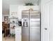 Kitchen featuring stainless steel refrigerator and white cabinets at 202 Zircon Rd, Kissimmee, FL 34758
