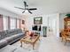 Comfortable living room with a modern decor, looking to the dining area at 202 Zircon Rd, Kissimmee, FL 34758