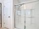 Modern glass enclosed shower with chrome fixtures and tiled walls at 202 Zircon Rd, Kissimmee, FL 34758