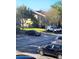 Exterior view of the apartments with parking, green space, and mature trees creating an inviting curb appeal at 2047 Dixie Belle Dr # 2047 T, Orlando, FL 32812