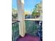 This balcony overlooks a green space, has black metal railings and an outdoor air conditioning unit at 2047 Dixie Belle Dr # 2047 T, Orlando, FL 32812