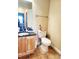 Bathroom featuring tile floors, wood cabinet, and toilet at 2047 Dixie Belle Dr # 2047 T, Orlando, FL 32812
