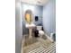 Bathroom featuring a pedestal sink, toilet, and black and white tile floor at 2047 Dixie Belle Dr # 2047 T, Orlando, FL 32812