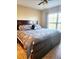 Bedroom featuring queen bed, ceiling fan, and natural light at 2047 Dixie Belle Dr # 2047 T, Orlando, FL 32812