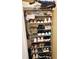 Organized closet with tiered shelving and a variety of shoes and personal items at 2047 Dixie Belle Dr # 2047 T, Orlando, FL 32812