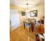 Cozy dining area with wooden table, chairs, and hardwood floors at 2047 Dixie Belle Dr # 2047 T, Orlando, FL 32812