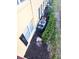 Exterior view showing AC units and manicured landscaping at 2047 Dixie Belle Dr # 2047 T, Orlando, FL 32812