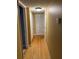 Hallway with hardwood floors, white doors, and access to rooms at 2047 Dixie Belle Dr # 2047 T, Orlando, FL 32812