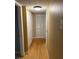 Hallway features neutral walls and white closet doors, and light hardwood flooring at 2047 Dixie Belle Dr # 2047 T, Orlando, FL 32812