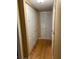 Hallway with hardwood floors and closet at 2047 Dixie Belle Dr # 2047 T, Orlando, FL 32812