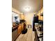 Functional kitchen with granite countertops, wooden cabinets, and appliances at 2047 Dixie Belle Dr # 2047 T, Orlando, FL 32812