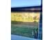View of lush greenery and trees through a window at 2047 Dixie Belle Dr # 2047 T, Orlando, FL 32812