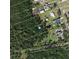 An aerial view of the land plot shows the property lines in an undeveloped area at 2086 Blackfoot Trl, St Cloud, FL 34771