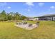 Expansive backyard with patio seating, ideal for outdoor gatherings and entertaining at 2086 Blackfoot Trl, St Cloud, FL 34771