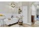 The bathroom showcases a soaking tub with a black faucet, wood look tile flooring, and pendant lighting at 2086 Blackfoot Trl, St Cloud, FL 34771