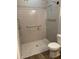 Accessible bathroom featuring a tiled shower with grab bars at 2086 Blackfoot Trl, St Cloud, FL 34771