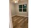 Bedroom with new wood-style flooring and large window offering natural light at 2086 Blackfoot Trl, St Cloud, FL 34771