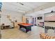 The recreational game room showcases a pool table, wet bar, and custom built-in cat stations at 2086 Blackfoot Trl, St Cloud, FL 34771