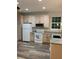 Kitchen with light wood cabinets, granite countertops, and stainless steel appliances at 2086 Blackfoot Trl, St Cloud, FL 34771