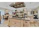 Kitchen island featuring a gas cooktop and ample storage at 2086 Blackfoot Trl, St Cloud, FL 34771