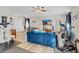 Living room showcasing exercise equipment, a TV, and a Murphy bed at 2086 Blackfoot Trl, St Cloud, FL 34771