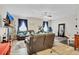 Living room featuring brown couches, TV, and a christmas tree at 2086 Blackfoot Trl, St Cloud, FL 34771