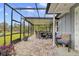 Screened-in patio with pavers and outdoor dining area at 2086 Blackfoot Trl, St Cloud, FL 34771