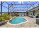 Sparkling pool inside a screened enclosure, set within a private backyard oasis at 2086 Blackfoot Trl, St Cloud, FL 34771