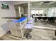 Stylish bar area featuring a modern bar with blue lighting and seating, perfect for entertaining guests at 2326 S Peninsula Dr, Daytona Beach, FL 32118